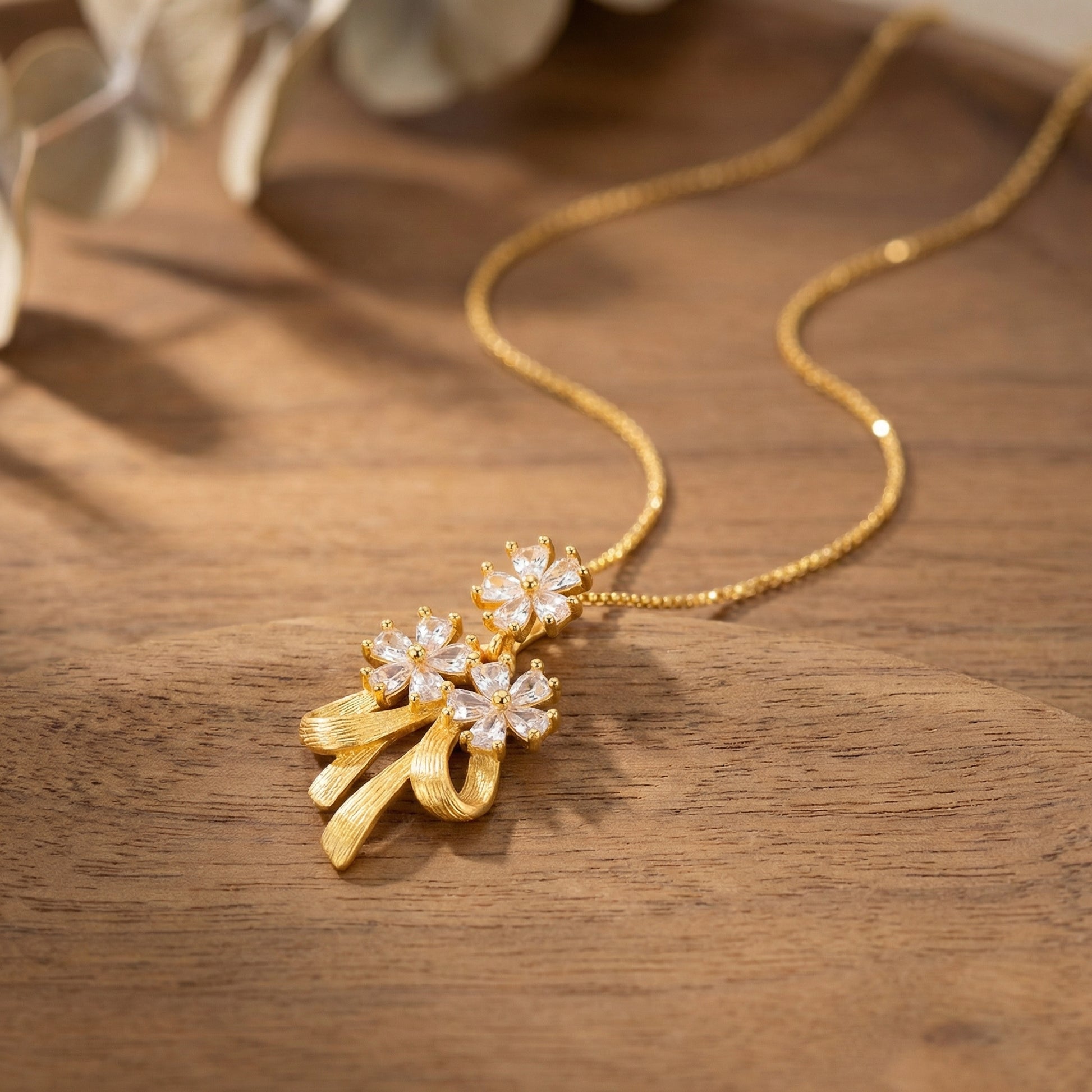 Gold plated flower and ribbon bow necklace jewelry